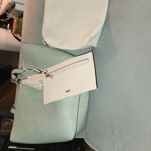 Large tote with tassel detail and interior bags.